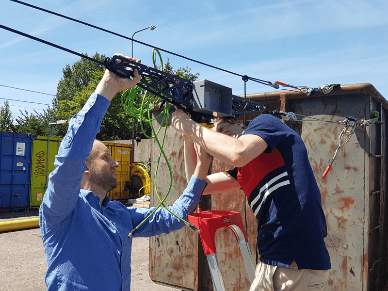 Prototype robot on a cable equipped with a line scanner for object detection.